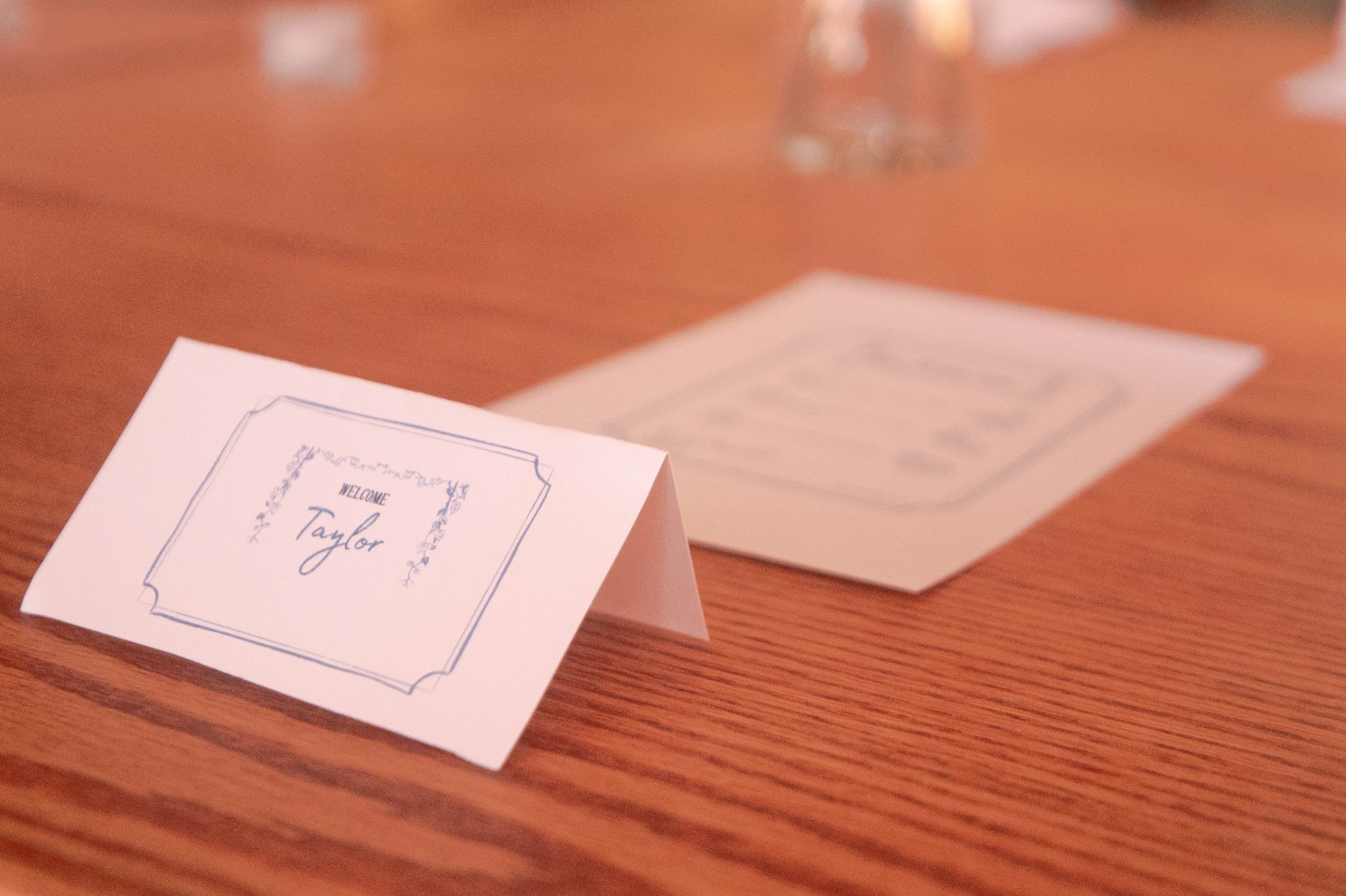 Place card on a wooden table at a Henwill tasting