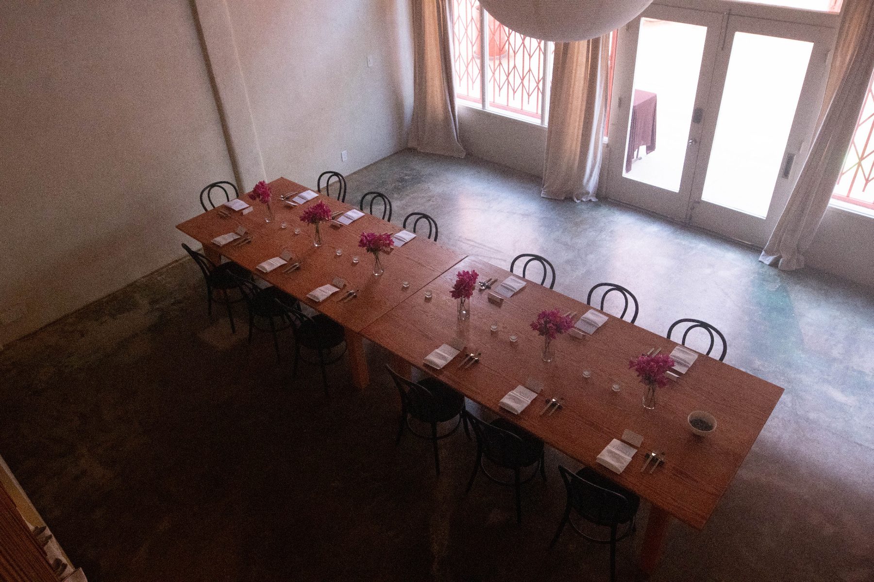Long dinner table set before a Henwill tasting