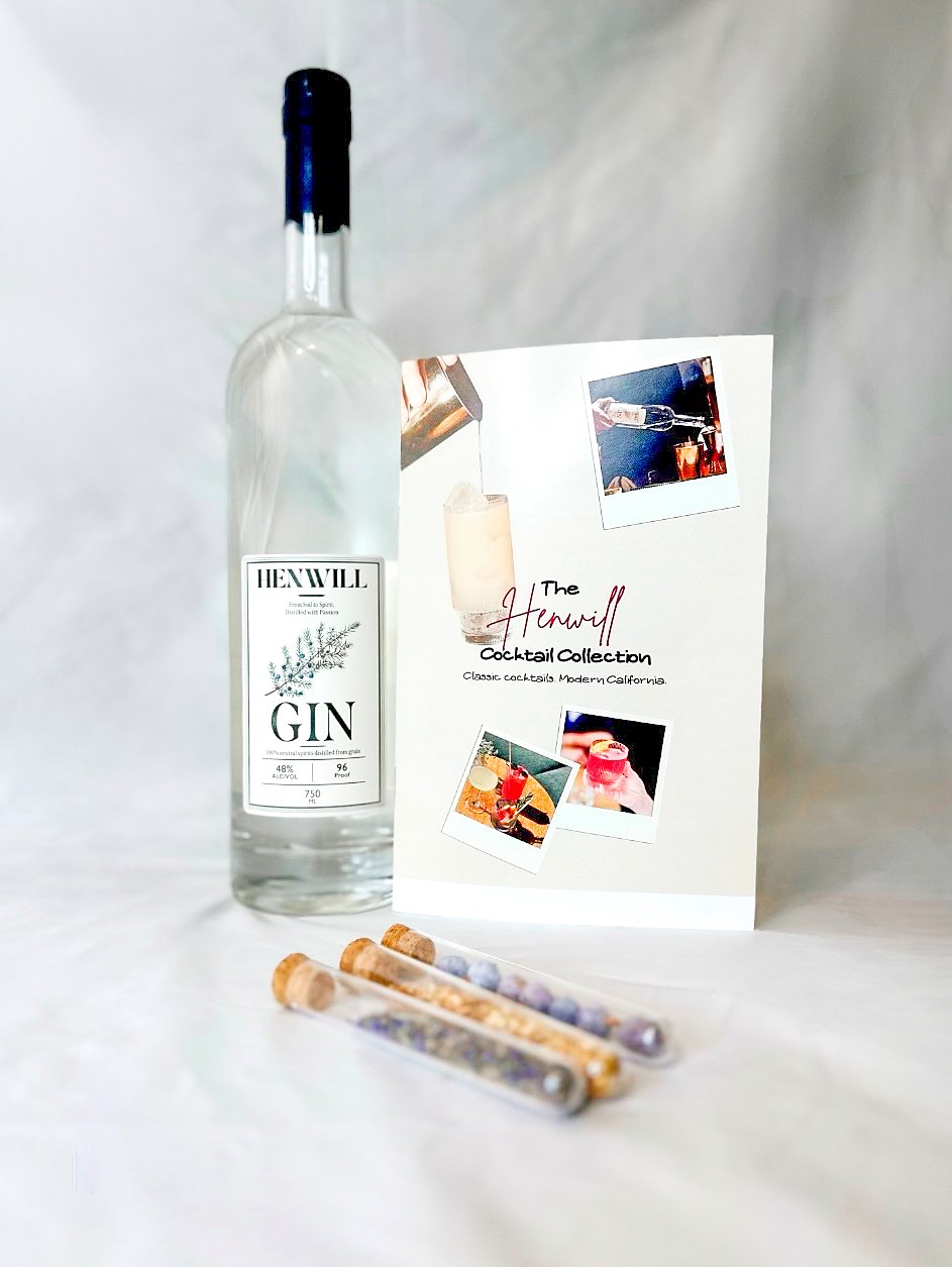 Henwill Gin bottle with the cocktail booklet and Sip & Smell botanical tubes