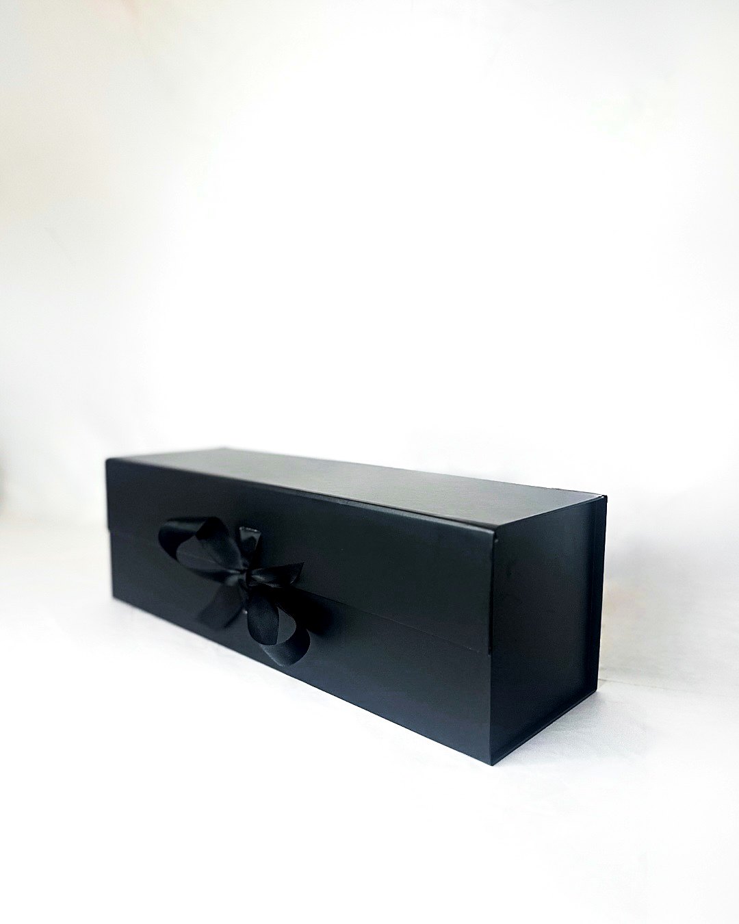 The closed keepsake box tied with a satin ribbon